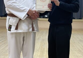 | Christopher receives his 1st Kyu certificate |