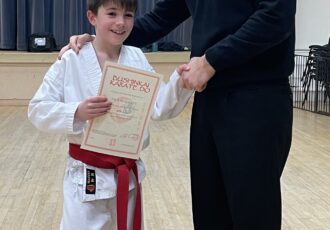 | Jack receives his 8th Kyu certificate |