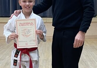 | Nate receives his 8th Kyu certificate |
