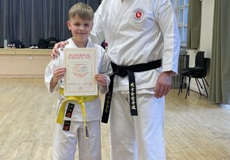Nate receives his 7th Kyu award from Sensei Damon