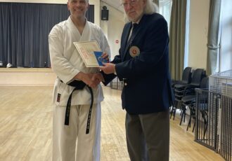 Damon receives his 3rd Dan award from Sensei Reg