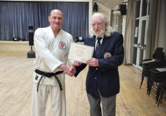 Darren receives his 4th Dan award from Sensei Reg